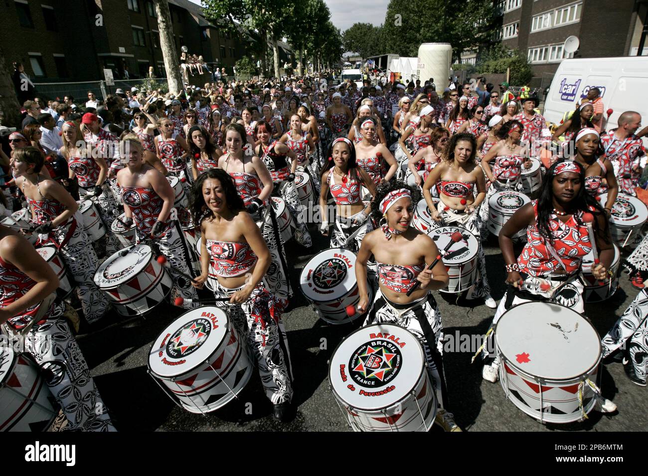 Participants in costumes play their drums and dance in formation as they  progress through the street during the Notting Hill Carnival, in London,  Monday Aug. 27, 2007. This year's theme, 'Set All