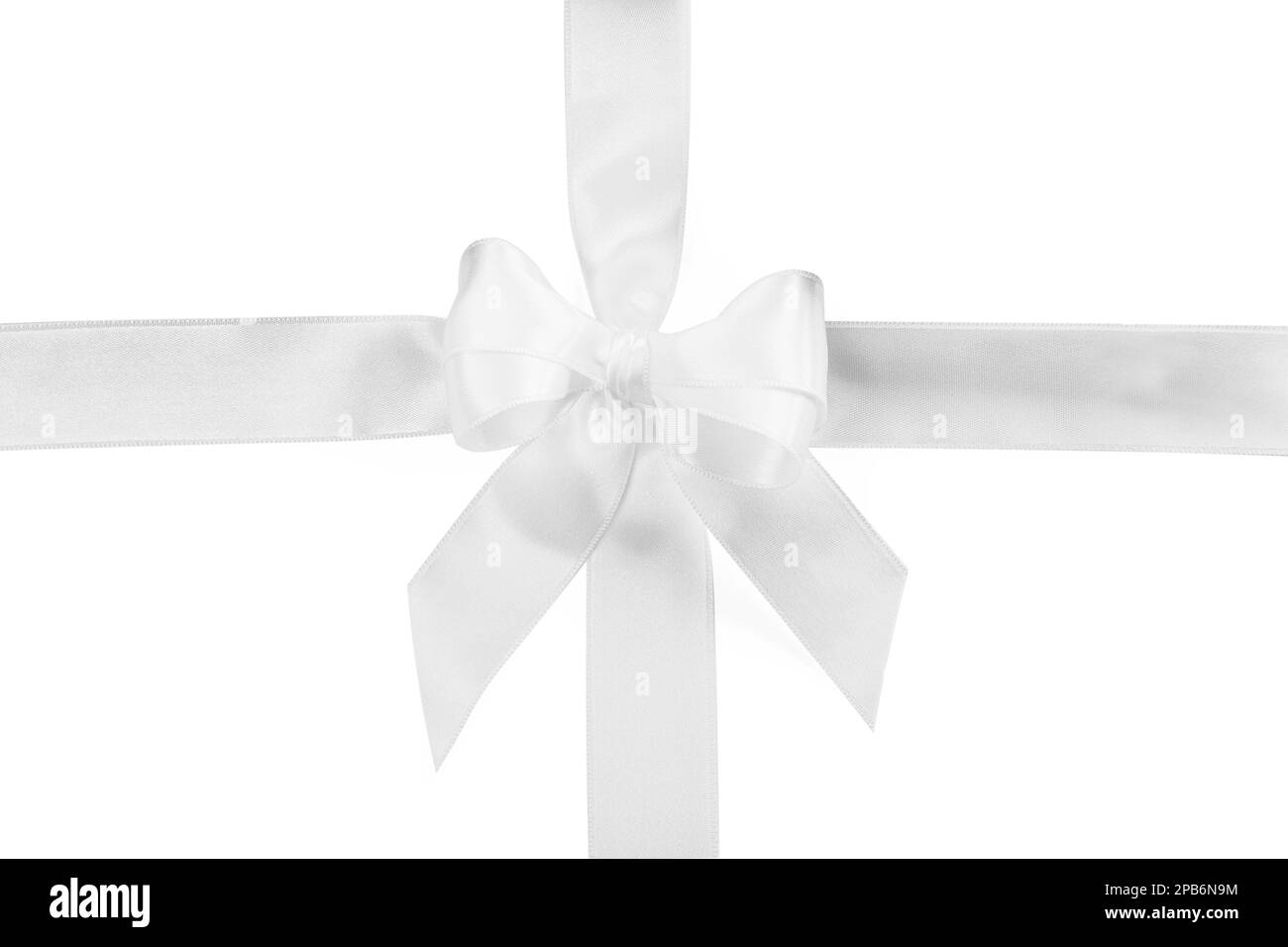 Satin ribbons with bow on white background, top view Stock Photo - Alamy