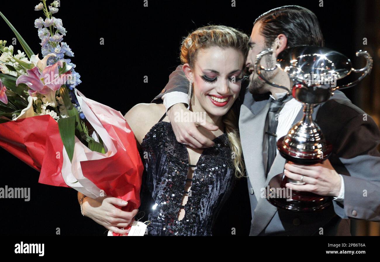 Argentinian couple Fernando Gracia and Natalia Tonelli hug each other after  winning the stage category finals of the 5th Tango Dance World  Championship, in Buenos Aires, Saturday, Aug. 25, 2007. (AP Photo/Natacha