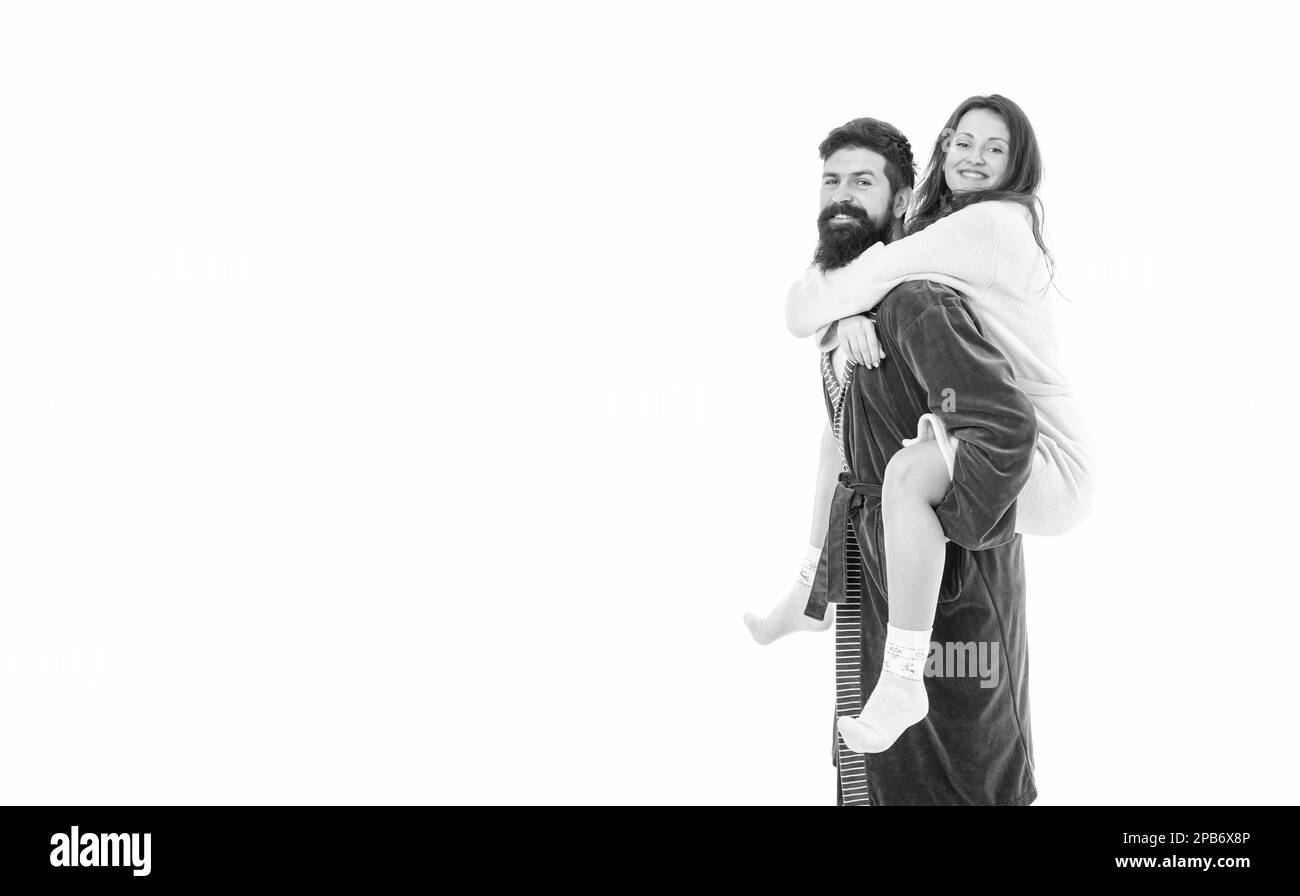 Happy girl ride piggyback on man in morning isolated on white copy space, relationship. Stock Photo
