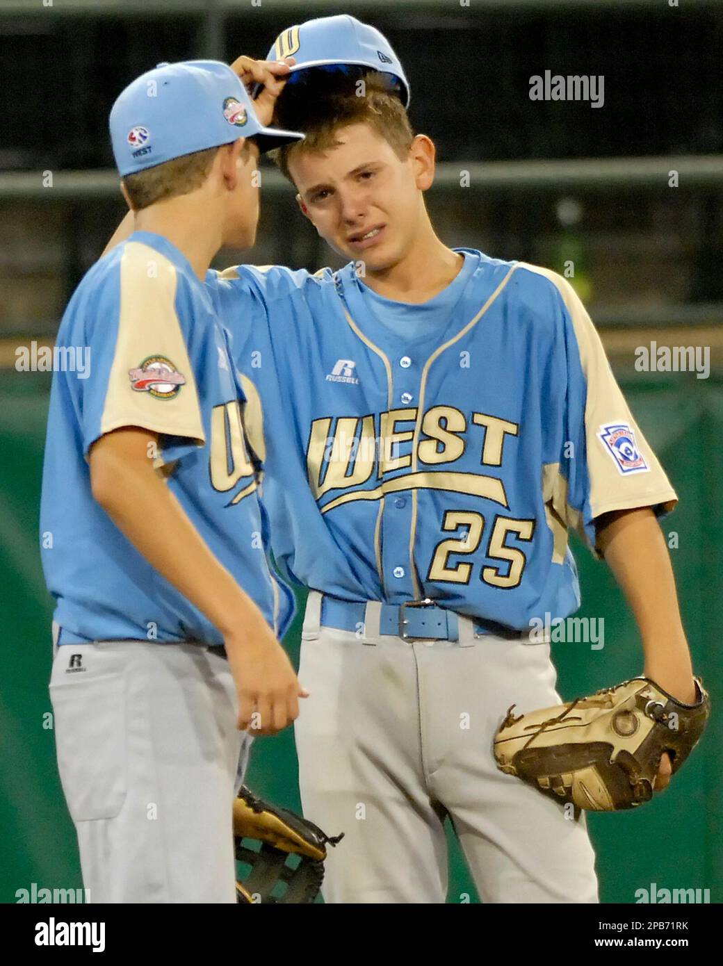 Chandler, Arizona, third baseman Seth Fretheim (25) talks with teammate Luke  Parrish after making an error late in a 16-6 loss to Warner Robins,  Georgia, in the United States semifinal baseball action