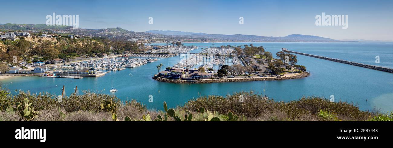 Dana Point Yacht Club, harbor, and marina with sailboats and yachts along the shores of the Pacific Ocean in southern California Stock Photo