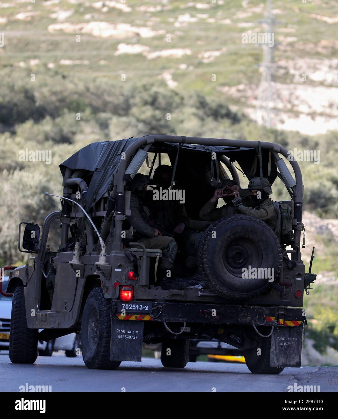 Surra, West Bank, Palestine. 12th Mar, 2023. Nablus, West Bank, Palestine. 12 March 2023. Israeli troops at the site where 3 Palestinian young men were killed on Sunday morning west of the West Bank city of Nablus. On Sunday the Israeli army announced the death of 3 Palestinian militants and the arrest of a fourth as they opened fire during a 'pre-emptive operation'' to neutralise three Palestinian gunmen in a car near the junction of the village of Surra, west of Nablus. After the operation the Israeli troops withheld the bodies of the three men and confiscated the vehicle. No Israeli casu Stock Photo