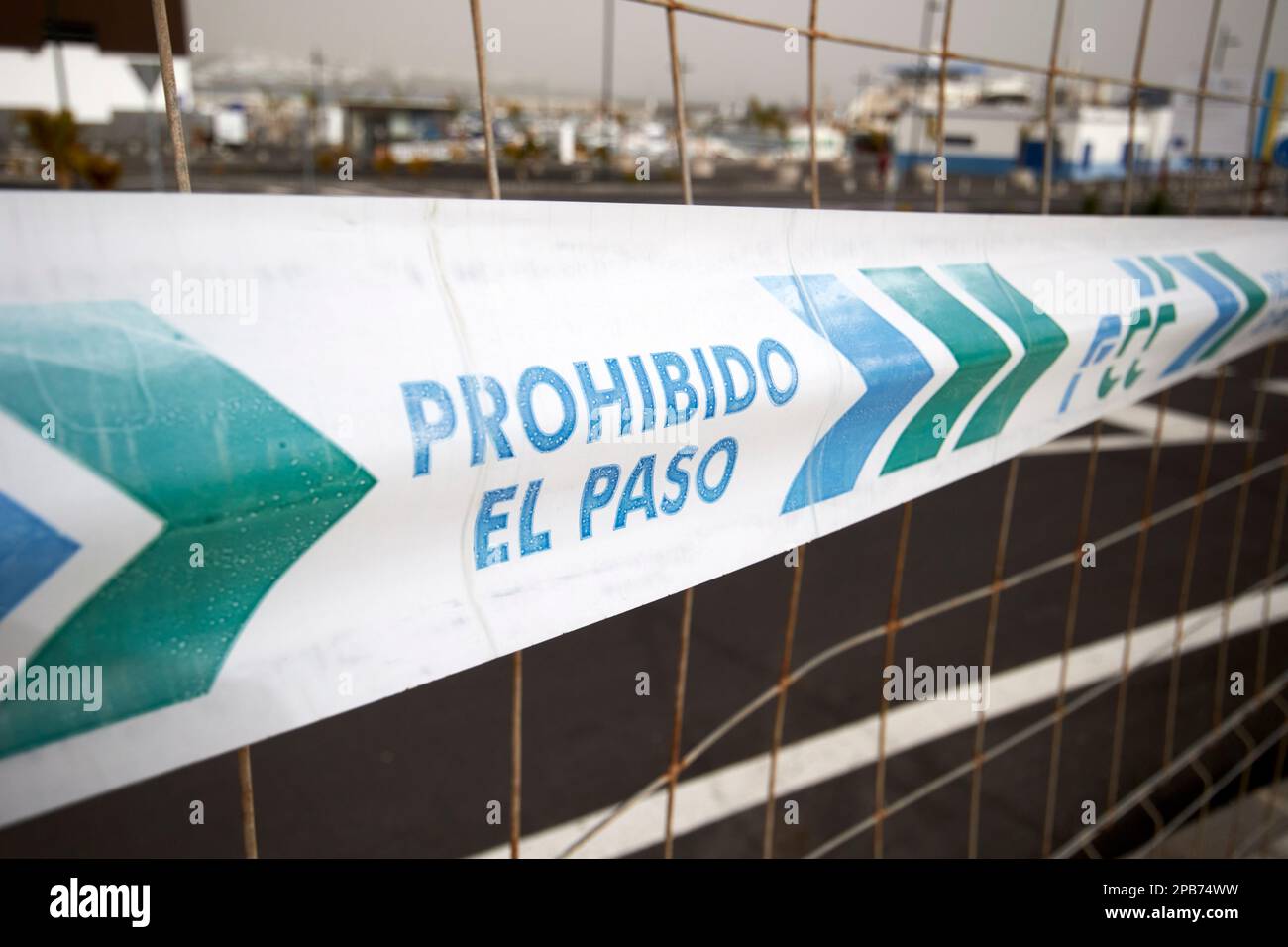 fcc prohibido el paso no entry barrier tape on fence in Lanzarote, Canary Islands, Spain Stock Photo