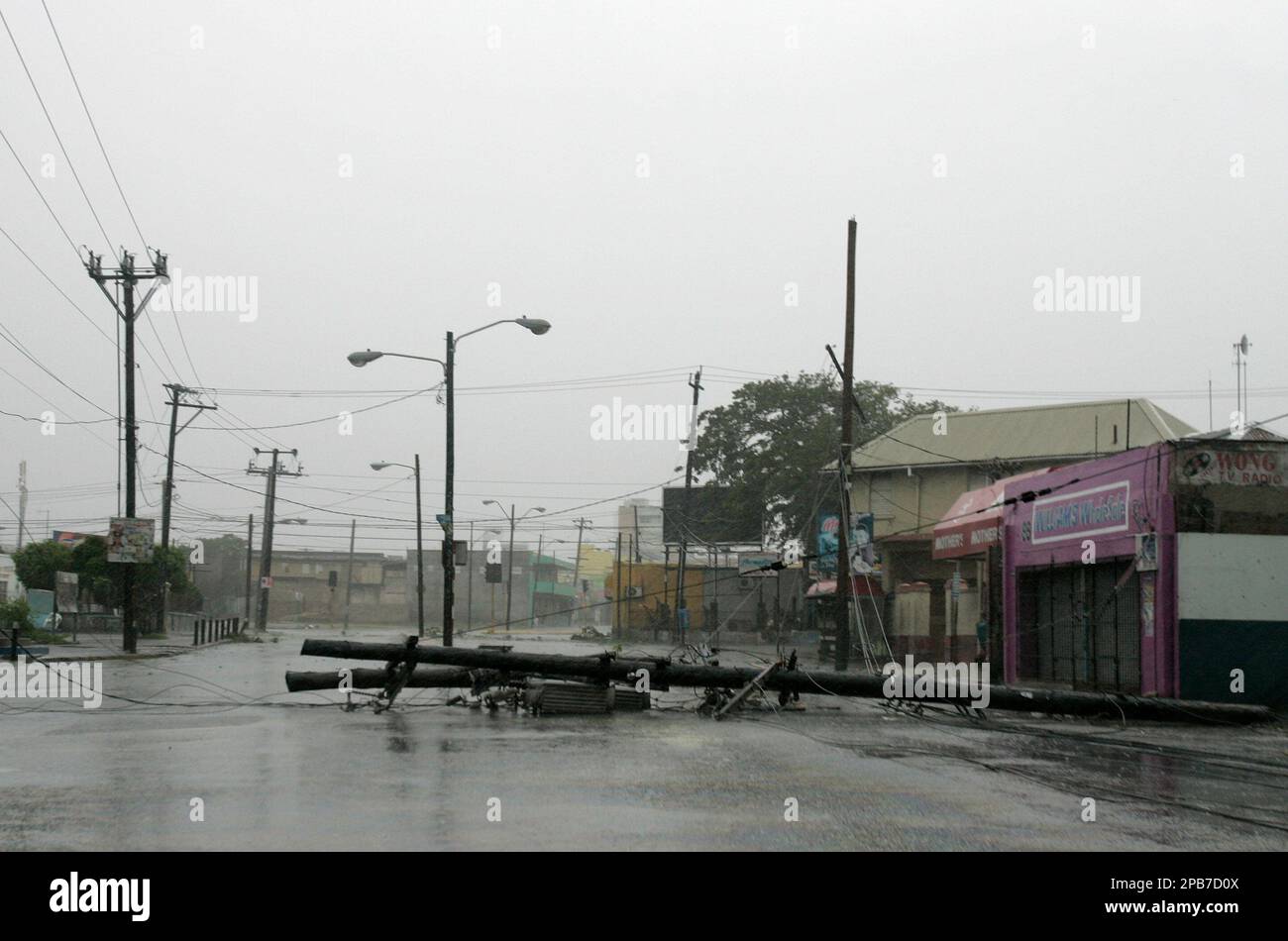 A lamp post knocked down by the strong winds of Hurricane dean is shown in  downtown Kingston, Jamaica, Sunday, Aug. 19, 2007. Hurricane Dean pummeled  this country with strong winds and torrential