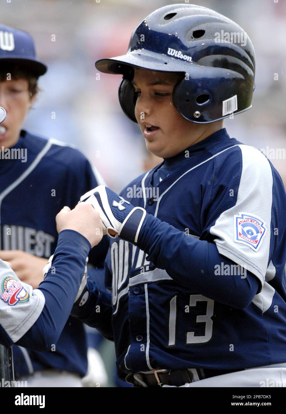 Young boy the batter running to first base during a Little League baseball  game Stock Photo - Alamy