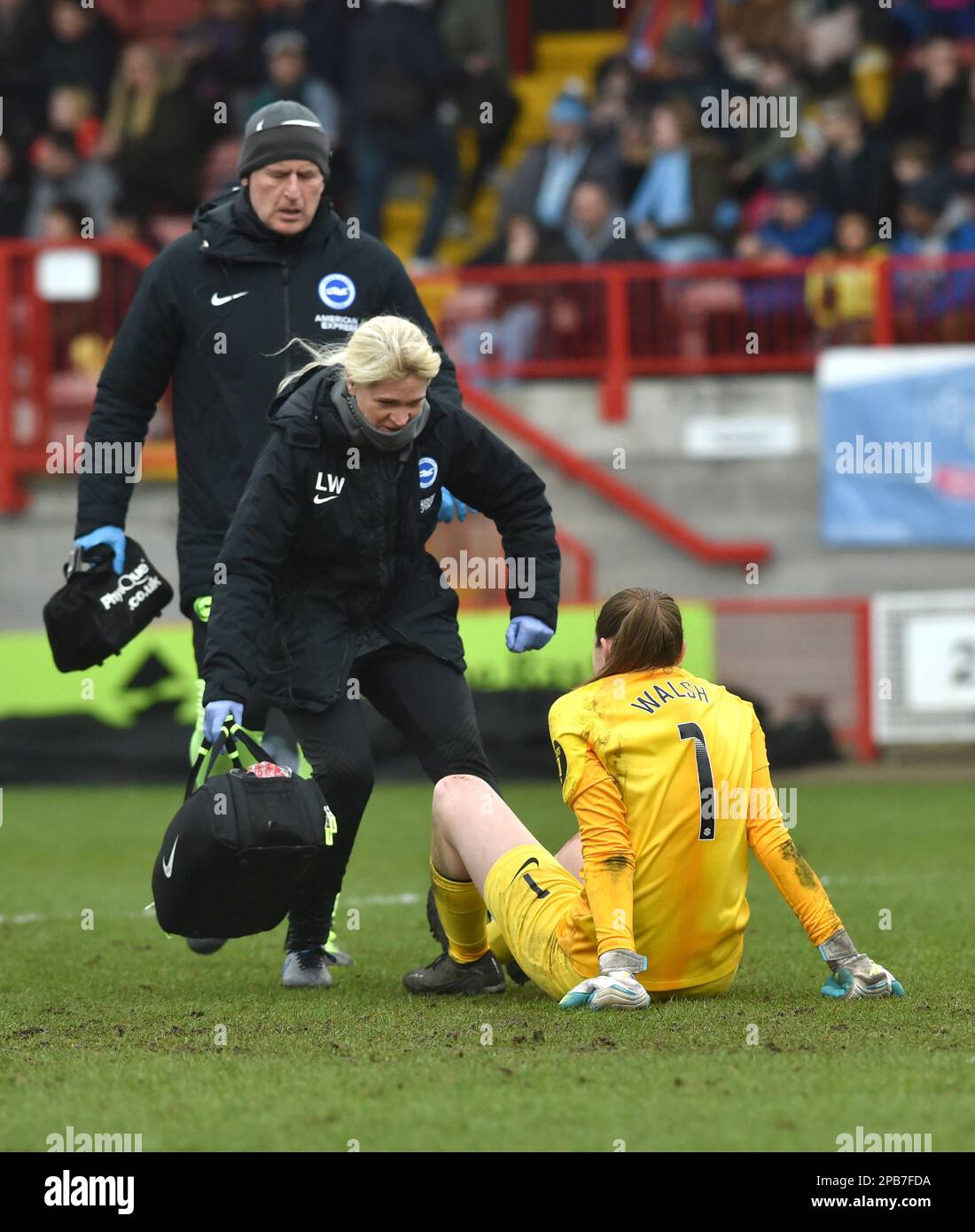 Crawley UK 12th March 2023 - Megan Walsh of Brighton receives treatment during the Barclays Women's Super League match between Brighton & Hove Albion and Manchester City   : Credit Simon Dack /TPI/ Alamy Live News Stock Photo