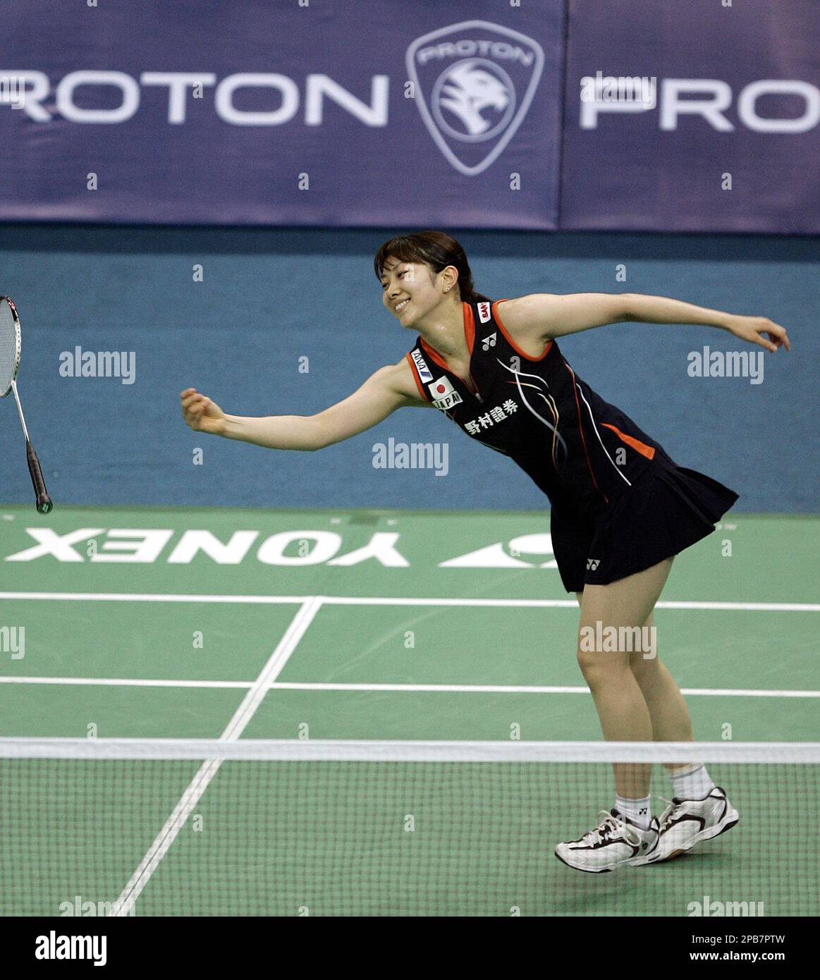 Japanese Kumiko Shiota throws her racket as she lost a point during the