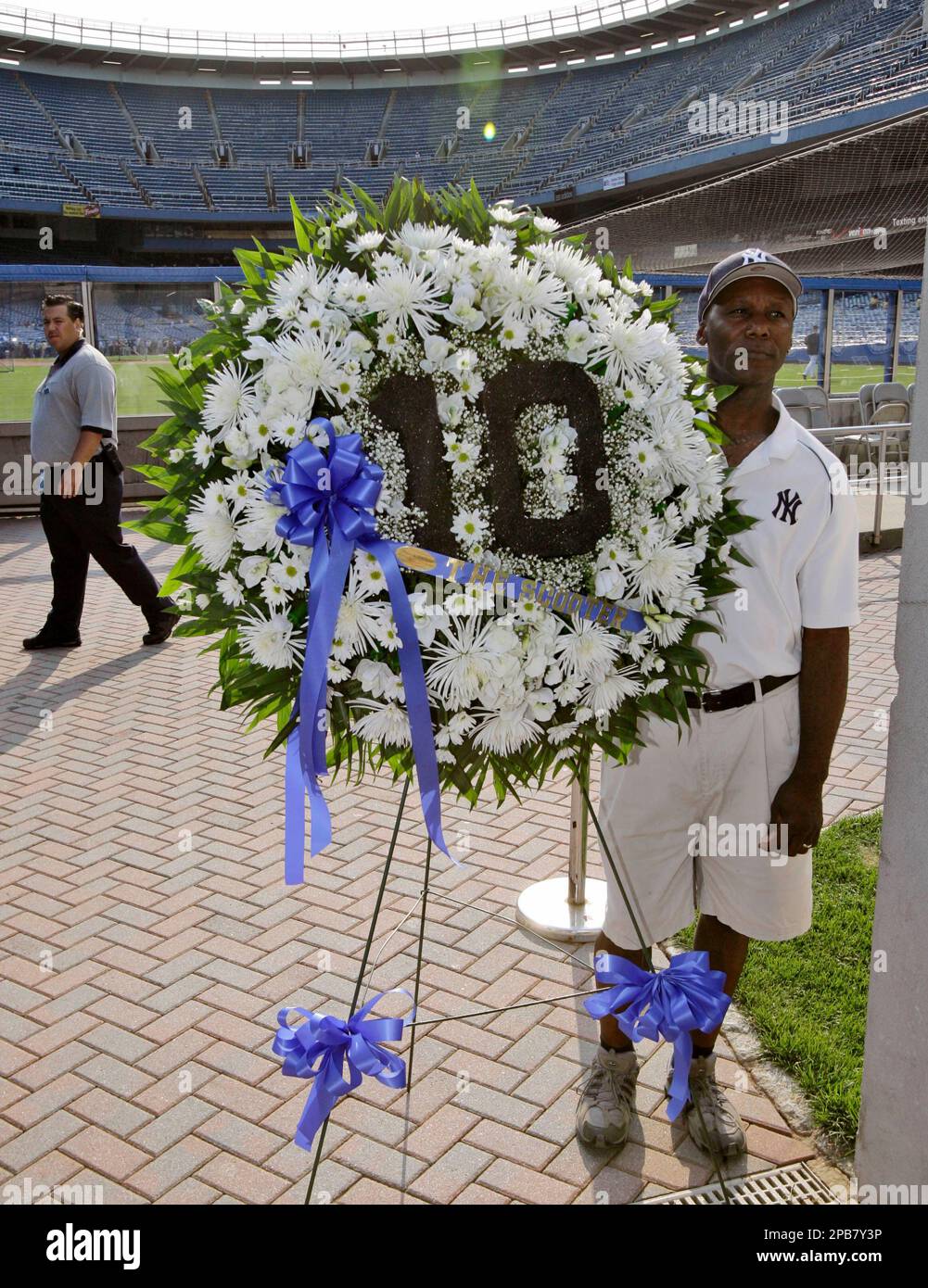 Clinton Thomas, a groundskeeper at Yankee Stadium, pauses before