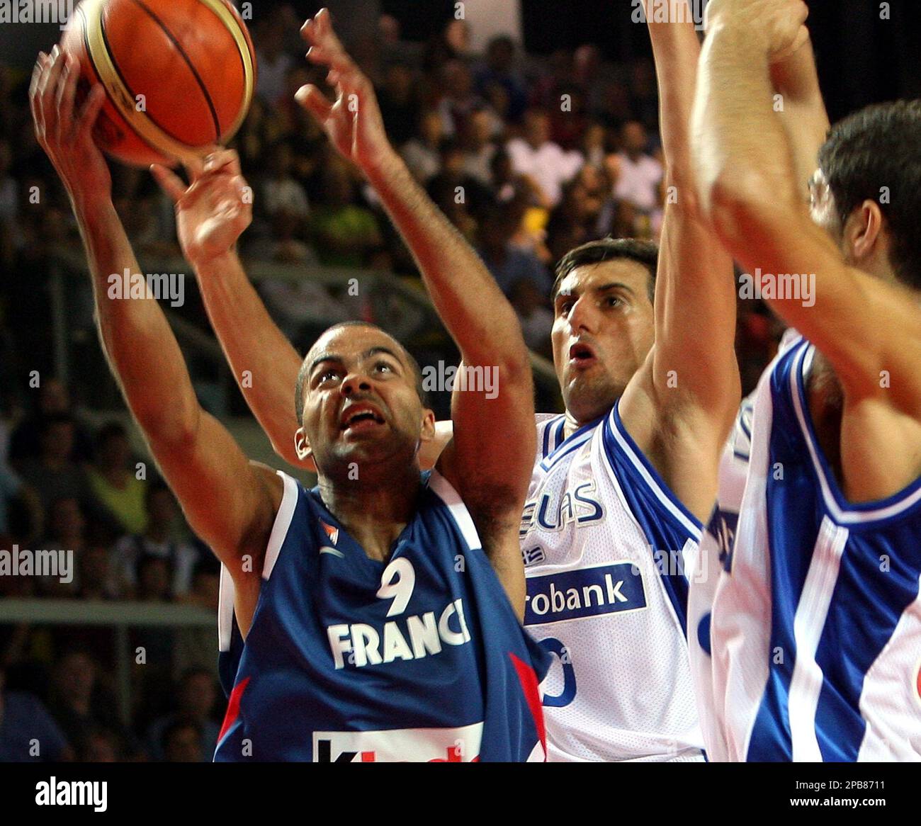 France's Tony Parker, left, tries to shoot as Nikos Hatzivretas, center and  Panagiotis Vasilopoulos defend for Greece during their basketball  Eurotournament match Saturday Aug. 11, 2007 in Strasbourg eastern France.  (AP Photo/Christian