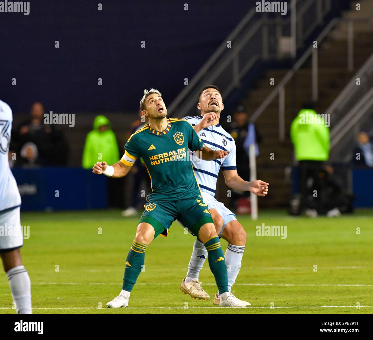 Kansas City, USA. 16th Nov, 2022. Los Angeles Galaxy midfielder Gastón Brugman (5, left) and Sporting Kansas City midfielder Roger Espinoza (15) wait for a ball in the air to drop. Sporting KC hosted the LA Galaxy in a Major League Soccer game on March 11, 2023 at Children's Mercy Park Stadium in Kansas City, KS, USA. Photo by Tim Vizer/Sipa USA Credit: Sipa USA/Alamy Live News Stock Photo