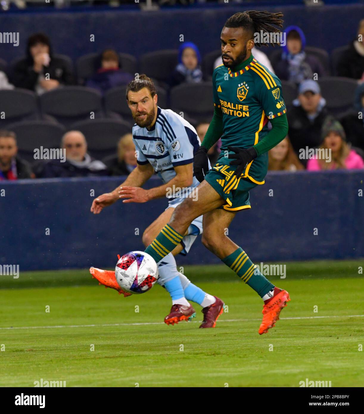 Kansas City, USA. 16th Nov, 2022. Los Angeles Galaxy defender Jalen Neal (24, front) moves the ball as Sporting Kansas City midfielder Graham Zusi (8) follows. Sporting KC hosted the LA Galaxy in a Major League Soccer game on March 11, 2023 at Children's Mercy Park Stadium in Kansas City, KS, USA. Photo by Tim Vizer/Sipa USA Credit: Sipa USA/Alamy Live News Stock Photo