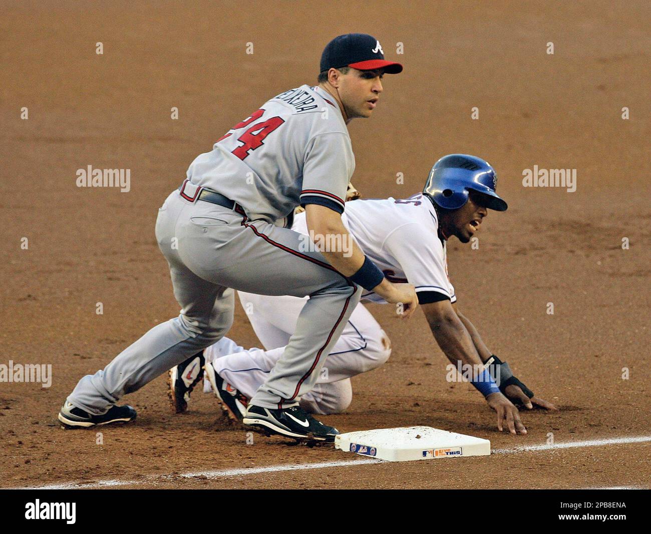 New York Mets David Wright makes a error throwing to first base in