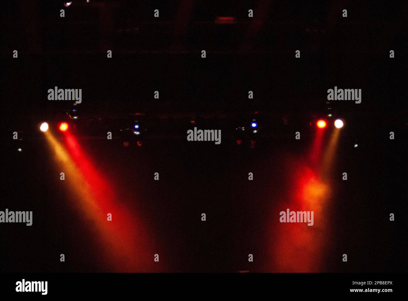Stage lighting, concert, theater, play or live event, background, red and yellow, spotlit or spotlights Stock Photo