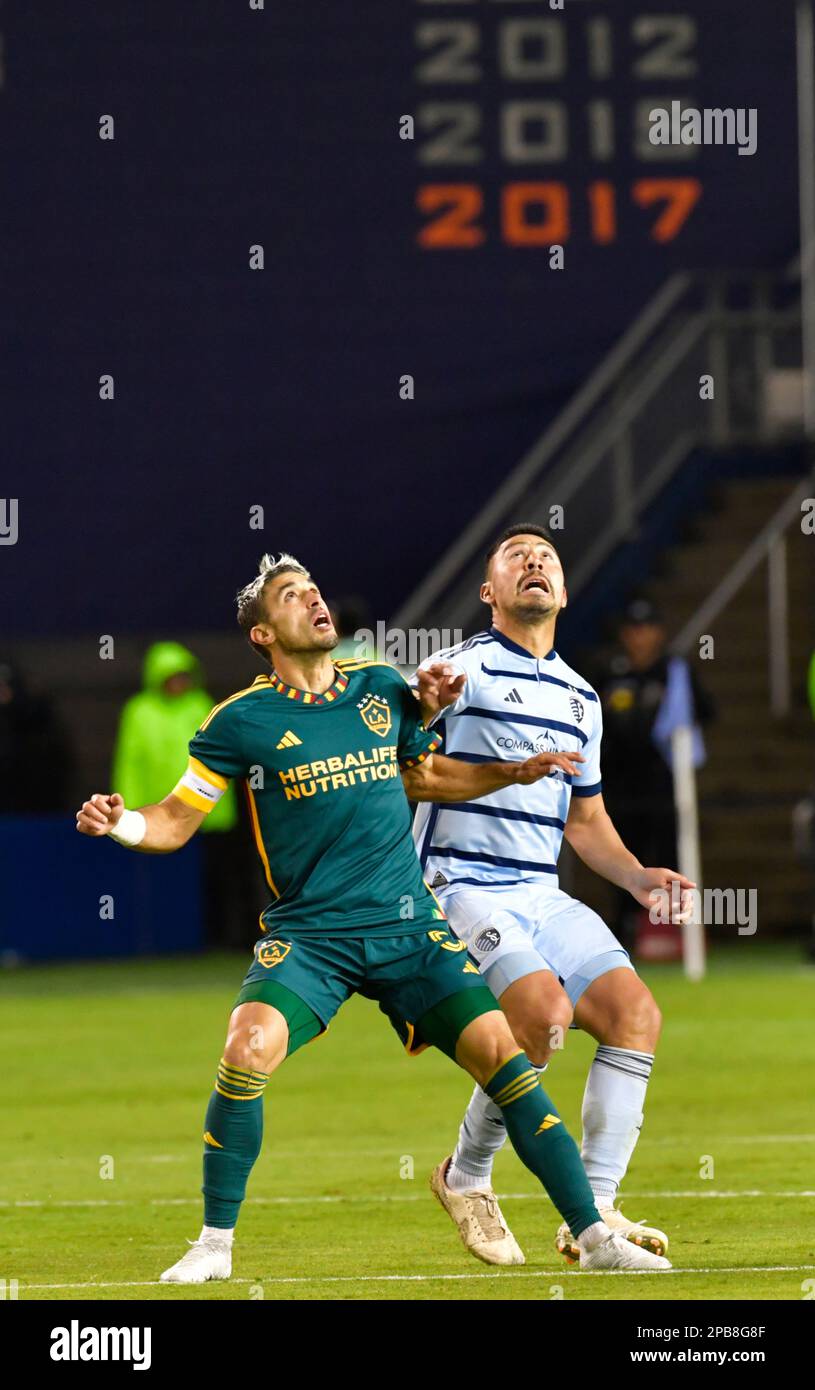 Kansas City, USA. 16th Nov, 2022. Los Angeles Galaxy midfielder Gastón Brugman (5, left) and Sporting Kansas City midfielder Roger Espinoza (15) wait for a ball in the air to drop. Sporting KC hosted the LA Galaxy in a Major League Soccer game on March 11, 2023 at Children's Mercy Park Stadium in Kansas City, KS, USA. Photo by Tim Vizer/Sipa USA Credit: Sipa USA/Alamy Live News Stock Photo