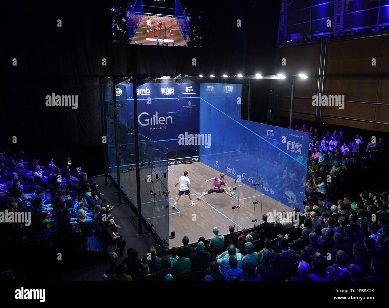 The crowd watch the round one BO3 match between Dimitri Steinmann and Karim Abdel Gawad during the Canary Wharf Squash Classic at the East Wintergarden, London. Picture date: Saturday March 12, 2023. Stock Photo