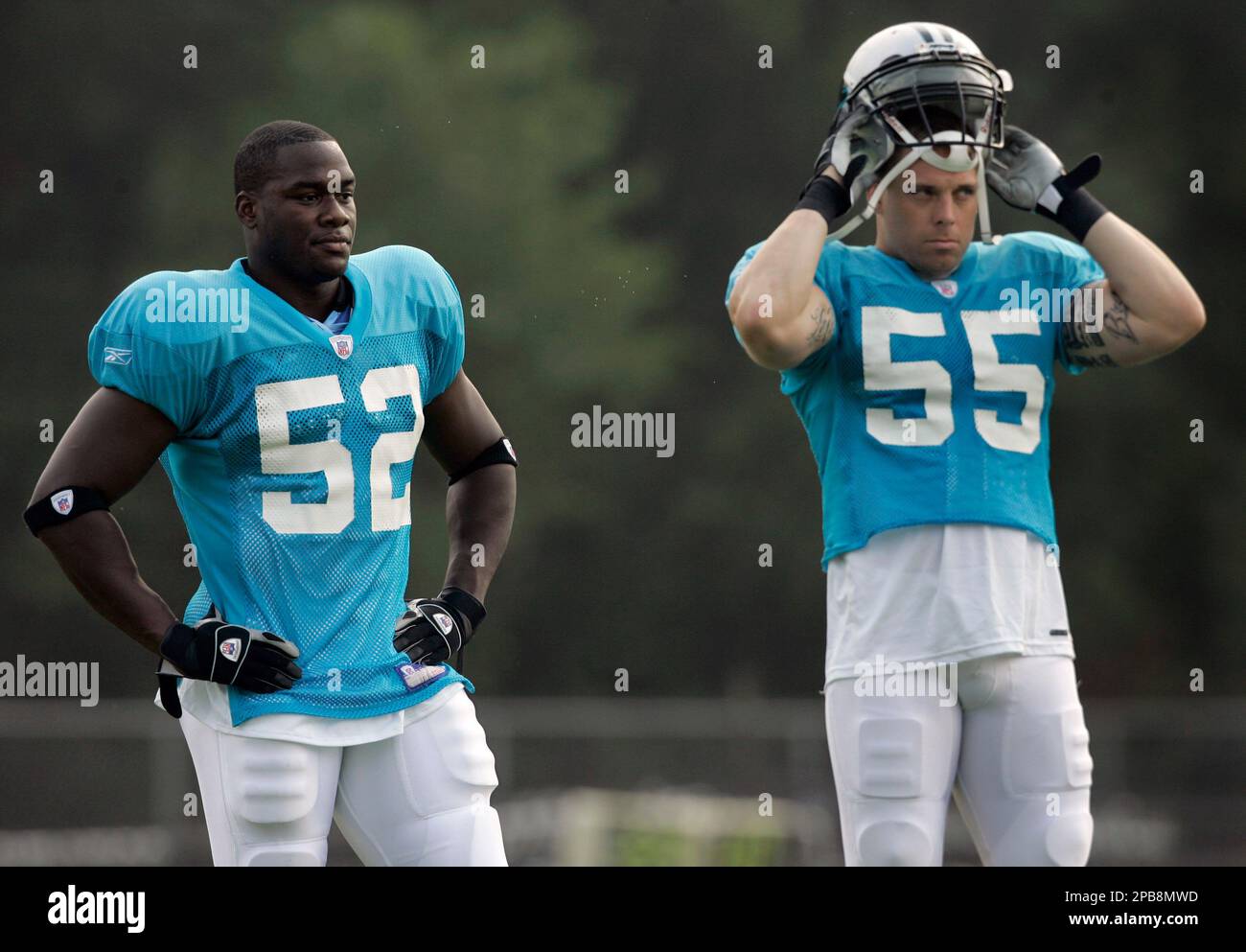 Carolina Panthers linebackers coach Ken Flajole gives instructions to  rookie Jon Beason during Beason's first practice at training camp in  Spartanburg, South Carolina, Monday, August 6, 2007. (Photo by David T.  Foster