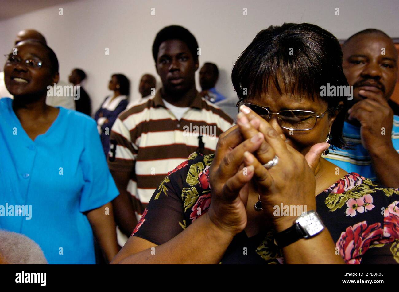 Rosie Simmons, right, grandmother of Mychal Bell, listens to the Rev