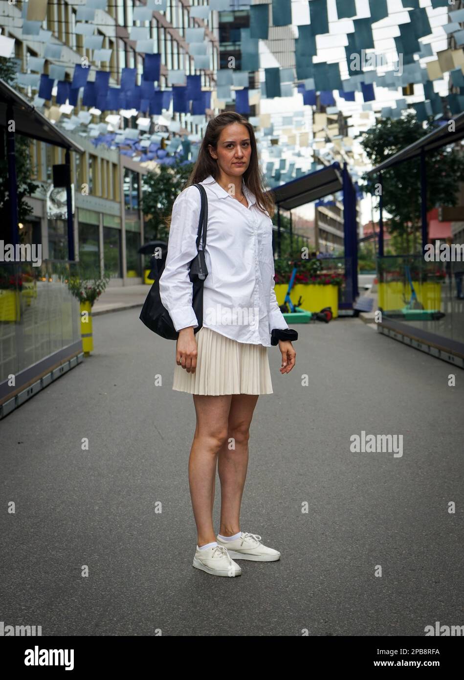 Woman standing on street hi-res stock photography and images - Alamy