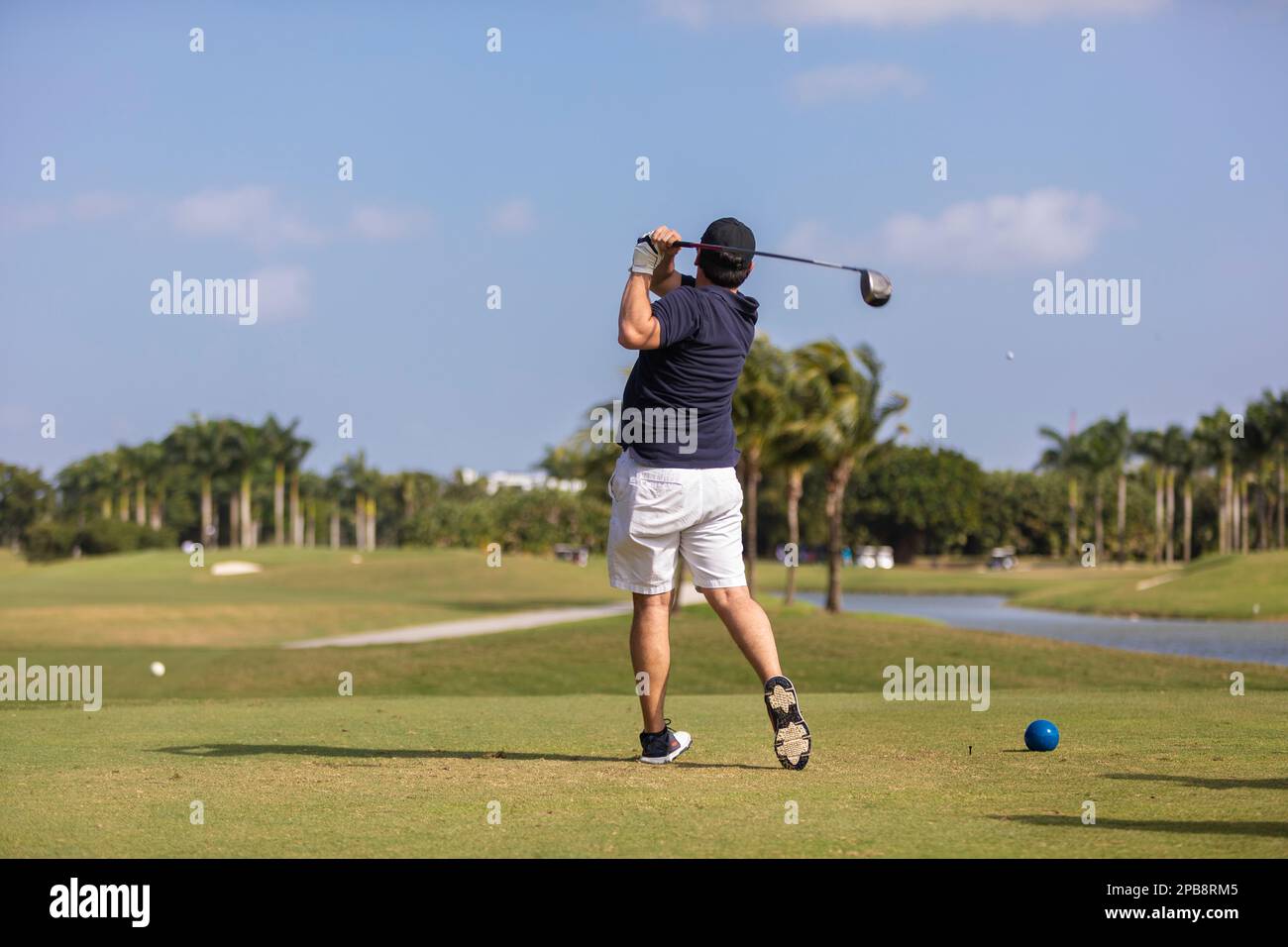 Men playing golf at Trump National Doral Golf Course Miami Florida Men playing golf at Trump National Doral Golf Course Miami Florida