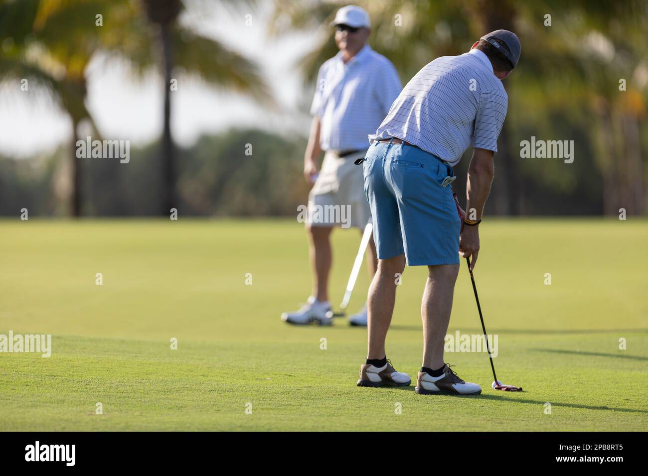 Men playing golf at Trump National Doral Golf Course Miami Florida