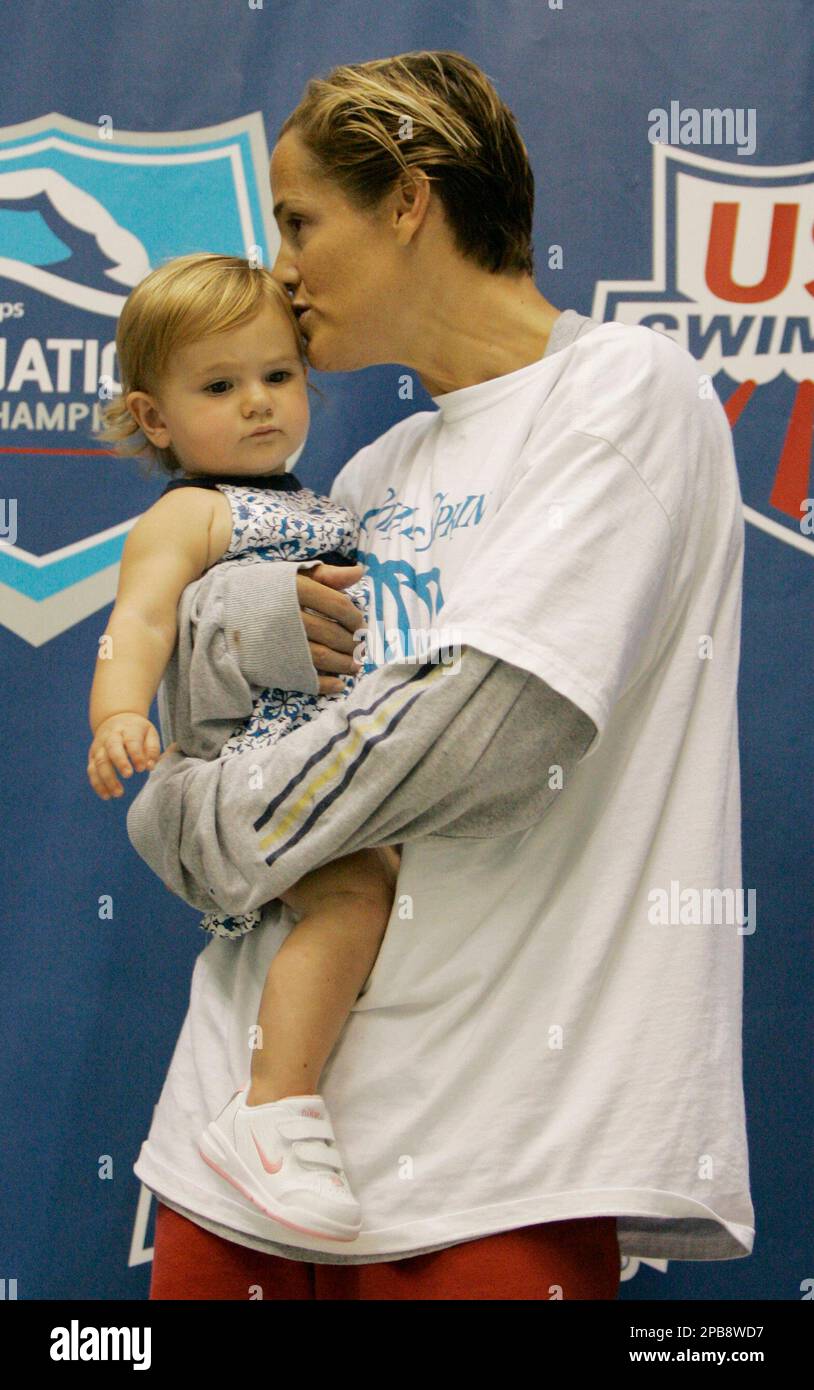 Swimmer Dara Torres gives her daughter, Tessa, a kiss as Dara awaited(02)