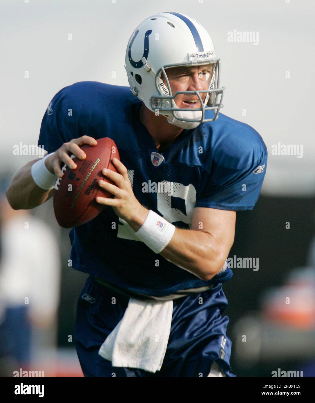 Indianapolis Colts quarterback Peyton Manning drops back to pass during drills at the team