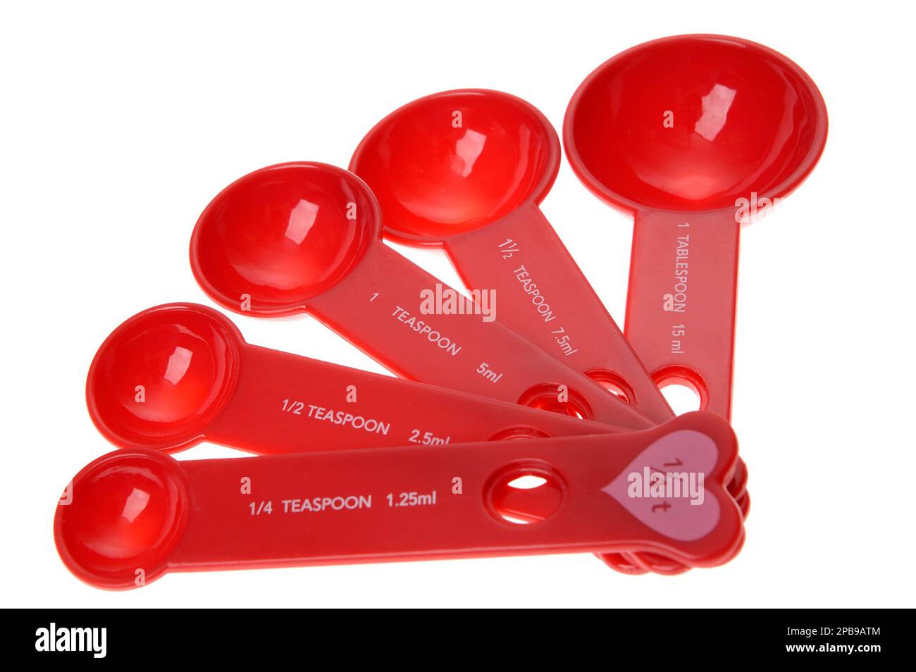 Measuring spoons, cooking utensils and kitchen items, red with pink