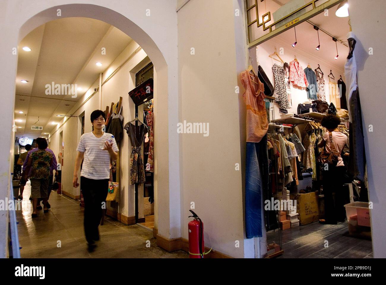 Visitors shop the fashion boutique inside the Nali Mall in Beijing, China,  Friday, July 27, 2007. If you tire of Olympic fever and can't stomach sites  jammed with flag waving throngs of