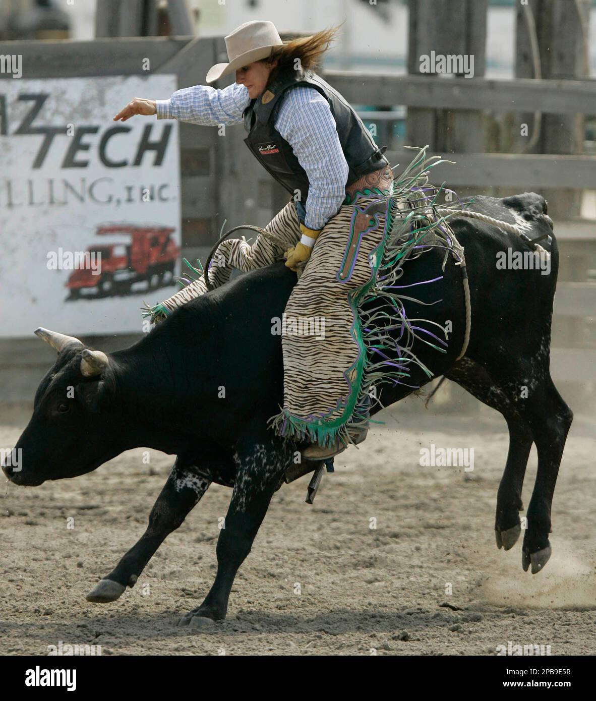 DeeDee Crawford, of Ben Wheeler, Texas, competes in the bull-riding ...