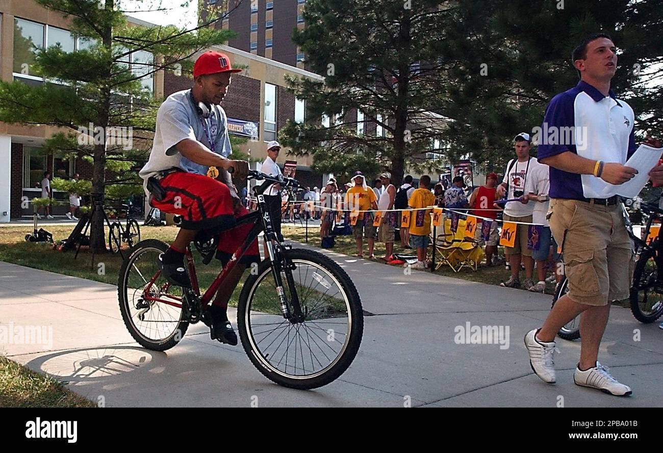 Minnesota Vikings third-round draft pick Marcus McCauley rides his bicycle  away from Gage Towers after reporting to the football team's training camp  Wednesday, July 25, 2007, in Mankato, Minn. (AP Photo/The Mankato