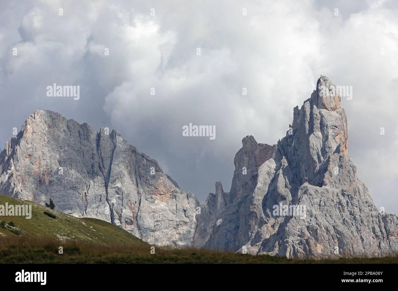 Clouds covering the mountain top of the Dolomites called CIMON DELLA PALA in Northern Italy Stock Photo