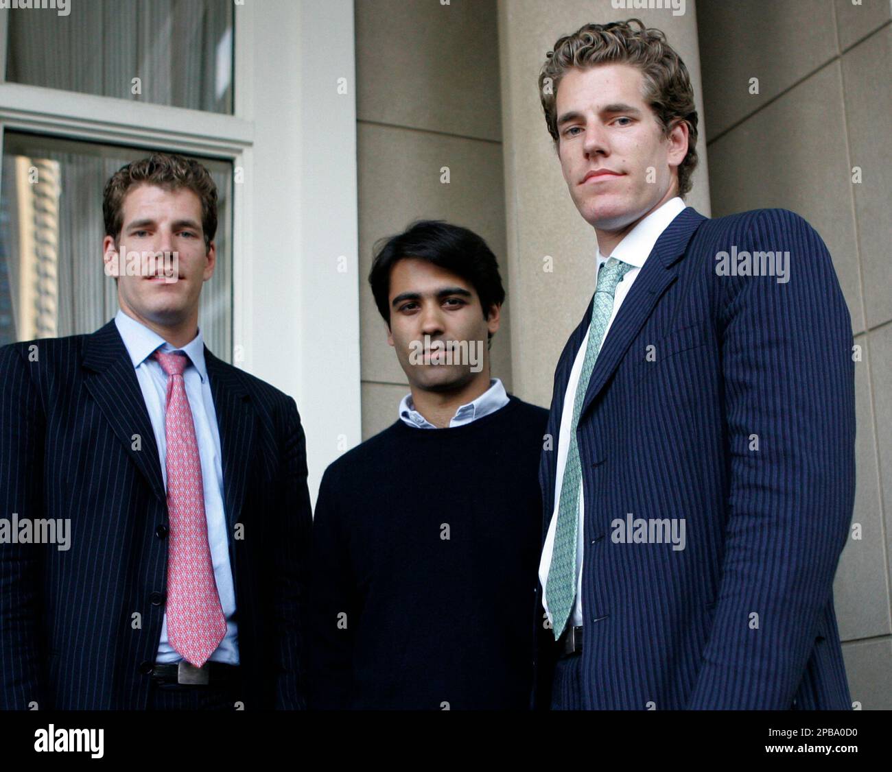 ConnectU founders Tyler Winklevoss, left, and Cameron Winklevoss, right,  who are twin brothers, and Divya Narendra pose following a news conference  in Boston, Wednesday, July 25, 2007. A federal judge gave the