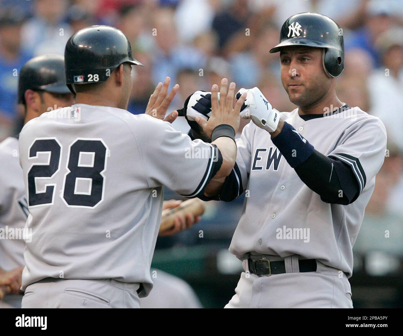 New York Yankees' Melky Cabrera, left, greets Derek Jeter after they both  scored on a single by Hideki Matsui in the first inning of a baseball game  with the Kansas City Royals