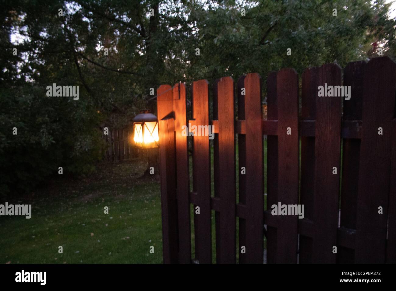 Lantern on fence hi-res stock photography and images - Alamy