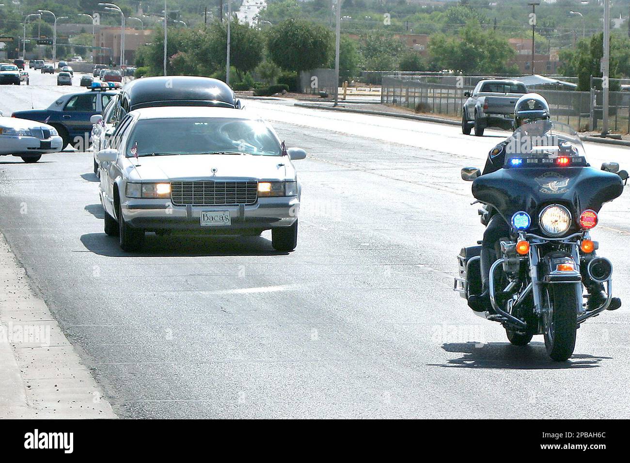 A Las Cruces Police Officer escorts the funeral procession of Edward E