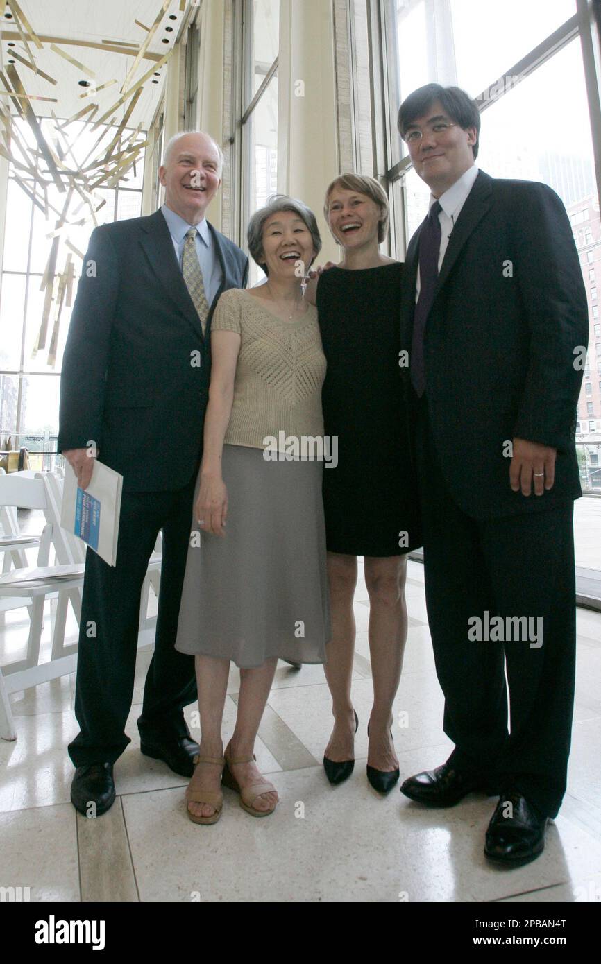Alan Gilbert, right, poses for a portrait with his wife ...