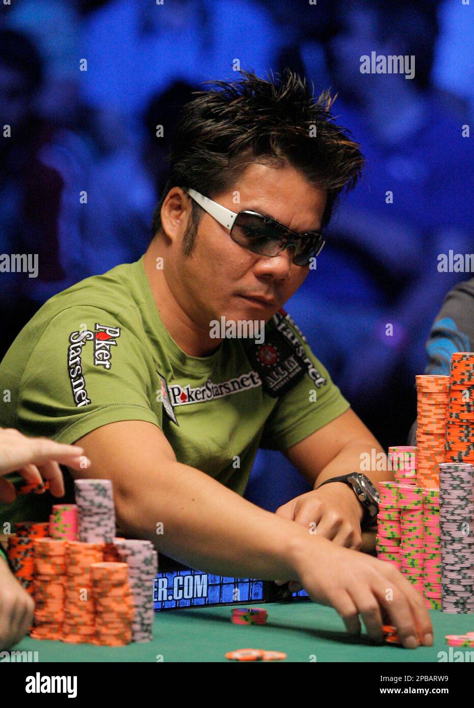 Professional poker player Tuan Lam, of Ontario, Canada, places his bet  while playing at the final table of the World Series of Poker at the Rio  hotel-casino in Las Vegas, Tuesday, July