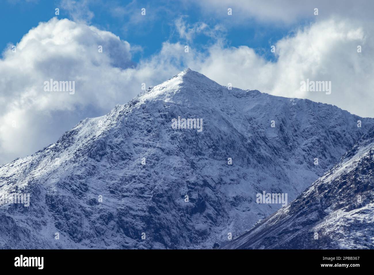 Snowdon mountain covered with snow, Snowdonia, North Wales Stock Photo