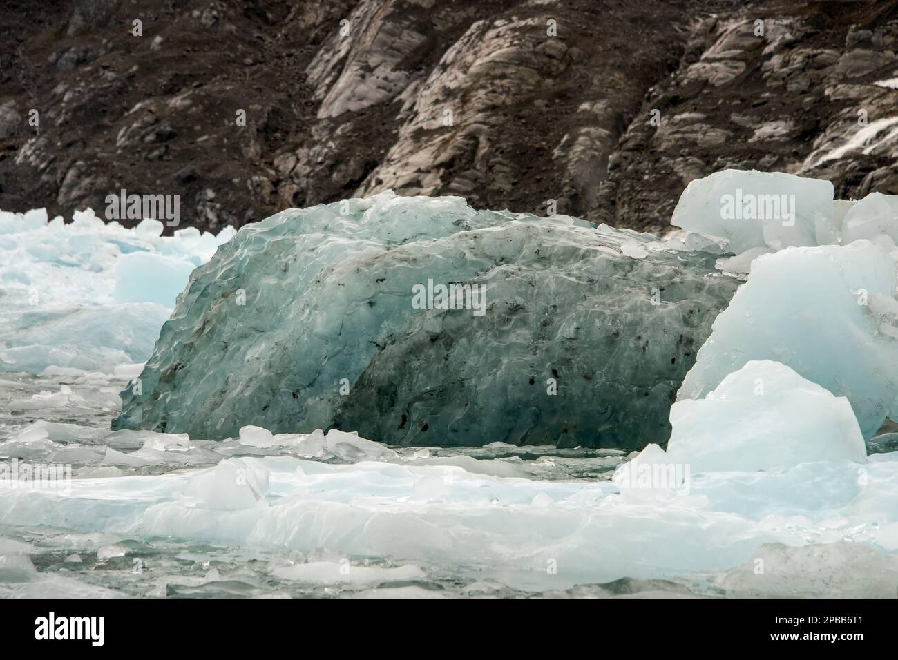 Old ice and newer ice near a cliff at the terminus of the Jorge Montt Glacier, Patagonia Stock Photo