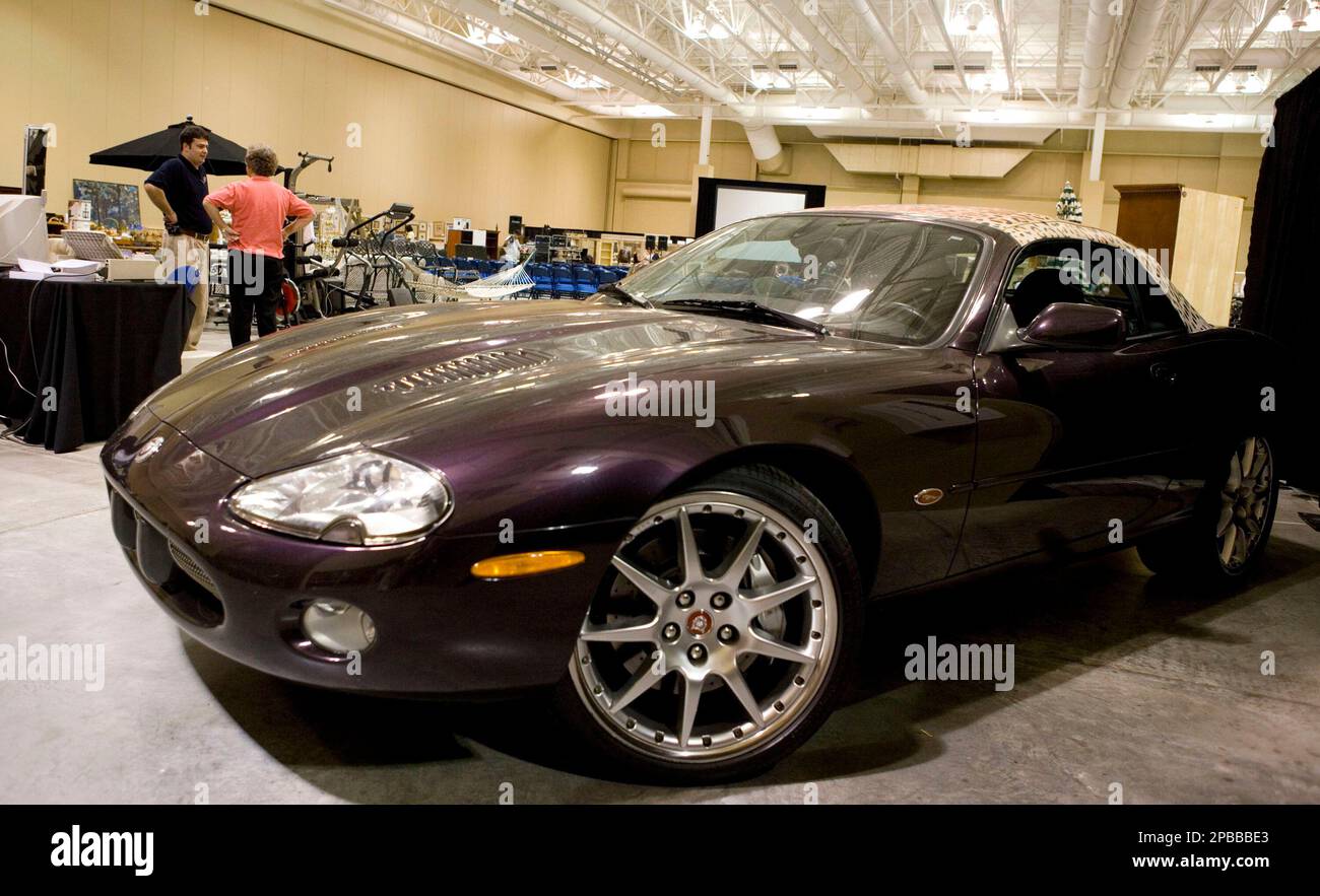 A purple Jaguar convertible is displayed at the Al Parish