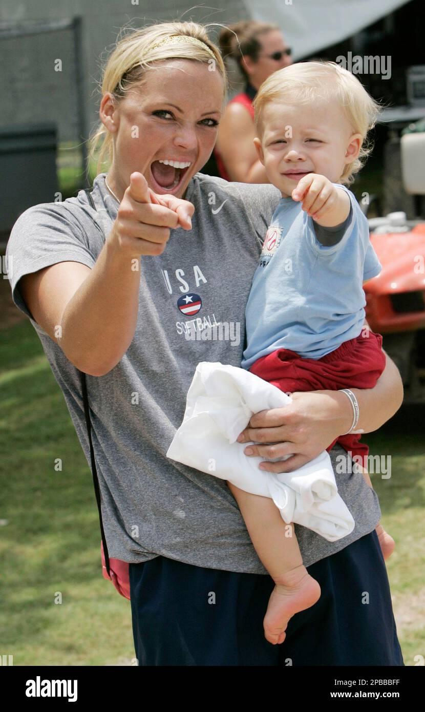 USA softball pitcher Jennie Finch holds her 14monthold son Ace Daigle(02)