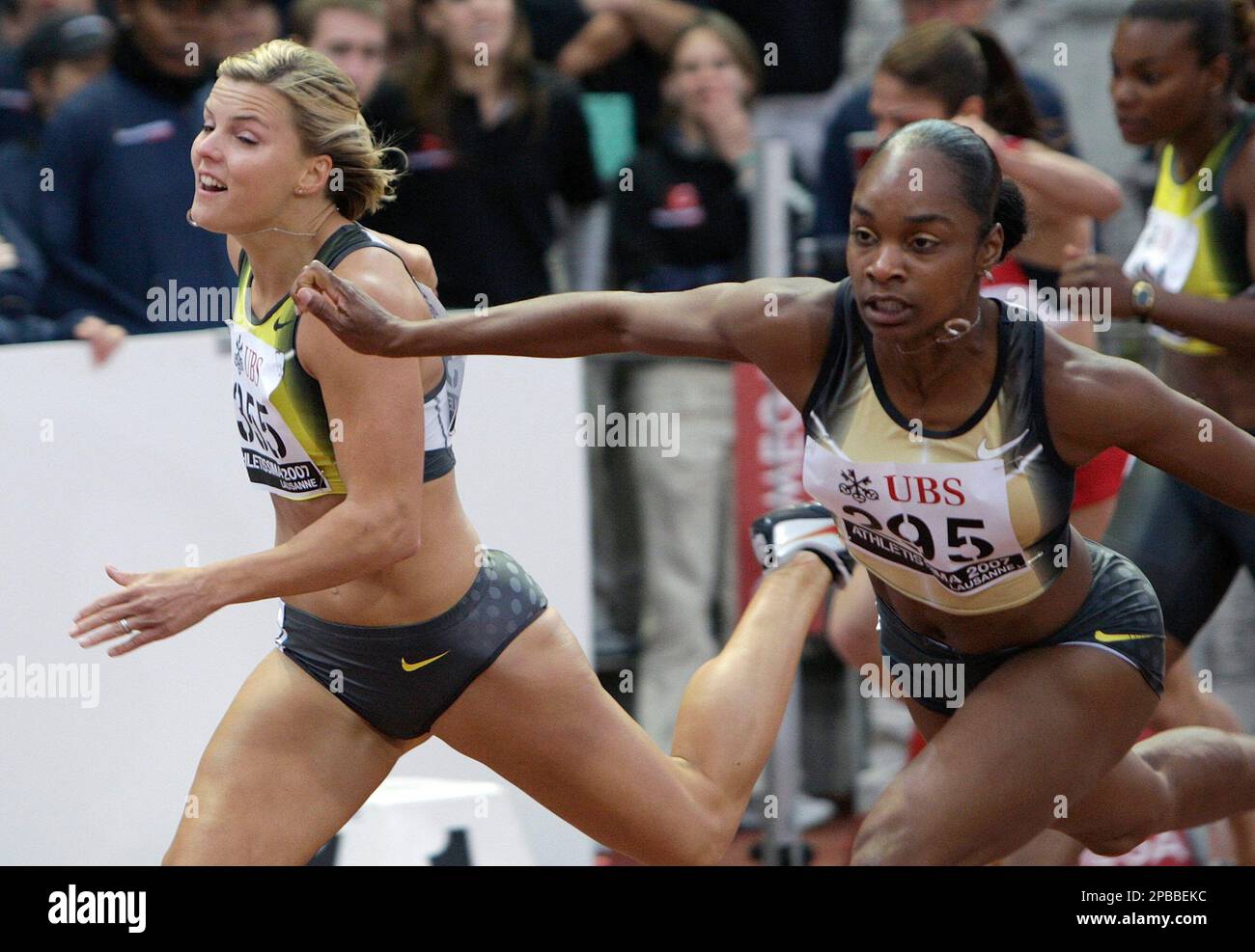 Michelle Perry, right, from the USA wins the women's 100 meters hurdles  race within 12.60 seconds ahead of second placed Susanna Kallur, left, from  Sweden at the Athletissima international athletics meeting in