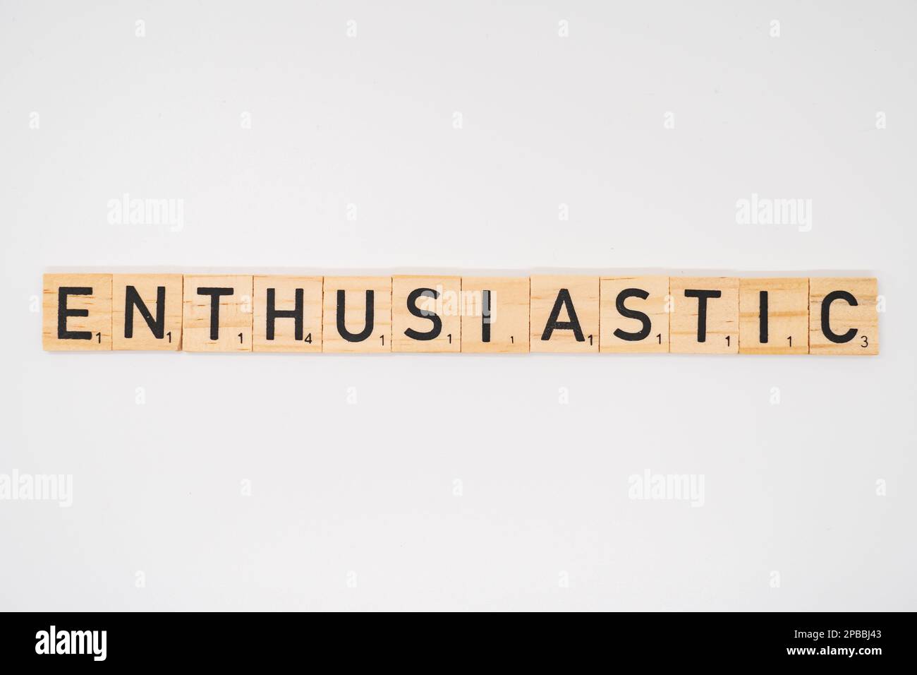 Wooden title spelling the word enthusiastic isolated on a white background Stock Photo