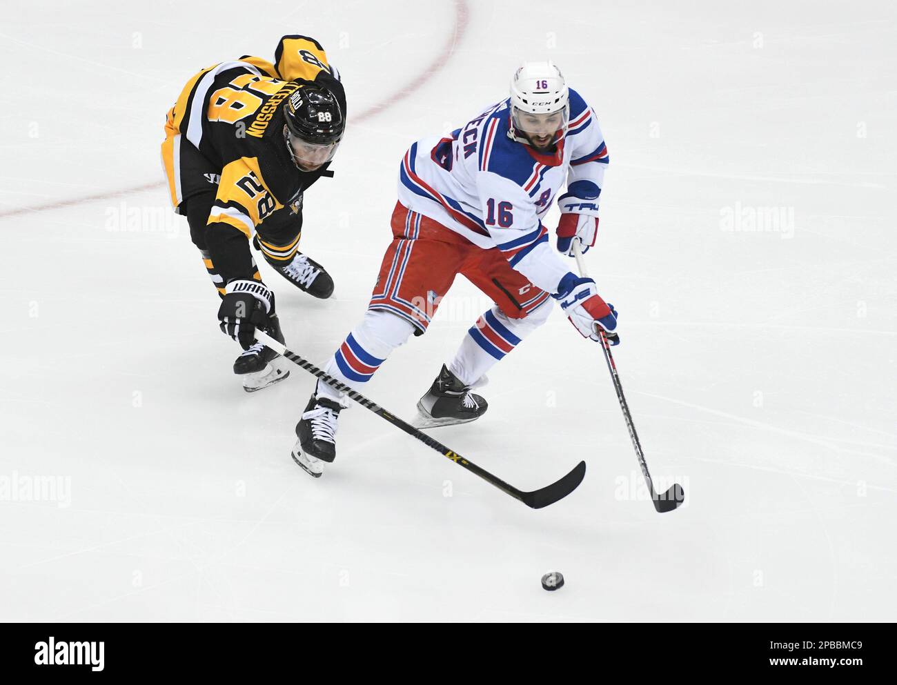 New York Rangers center Vincent Trochek (16) moves the puck from