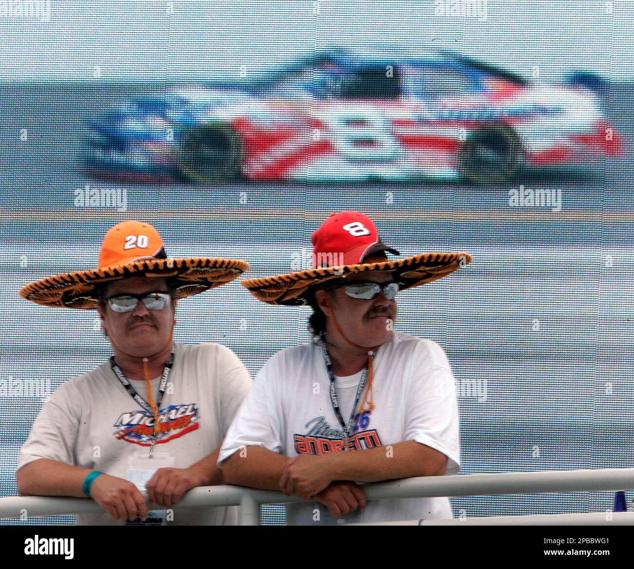 Dennis, left, and Dean Johnson, of Fargo, N.D., watch NASCAR drivers, including Dale Earnhardt Jr., take part in a Pepsi 400 practice Thursday afternoon Juloy 5, 2007 at the Daytona International Speedway