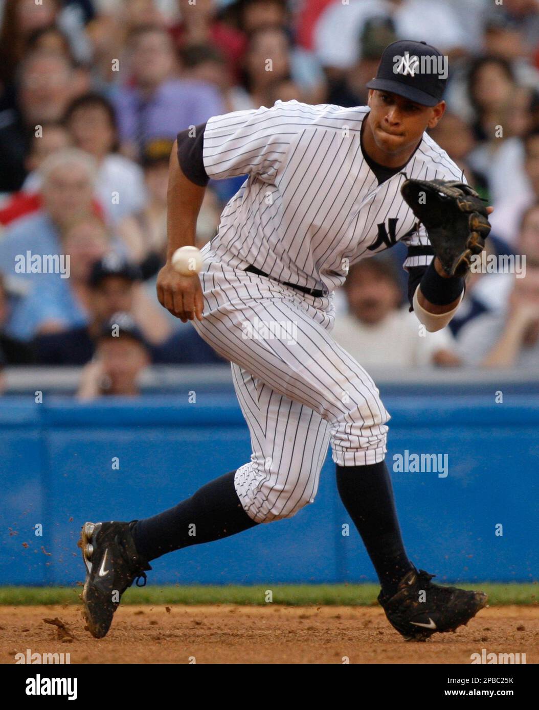 New York Yankees third baseman Alex Rodriguez fields a ground ball hit ...