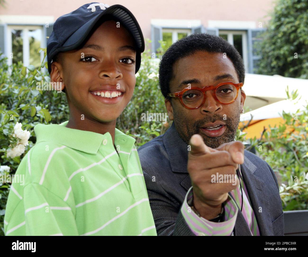 Filmmaker Spike Lee and his son Jack pose for the photographers, in Rome, Tuesday, July 3, 2007. Lee was in Rome to present a movie project on the struggle against Nazi occupiers in Italy that he hopes will highlight the contributions of black soldiers fighting in the U.S. army during the World War II. (AP Photo/Sandro Pace) Stock Photo