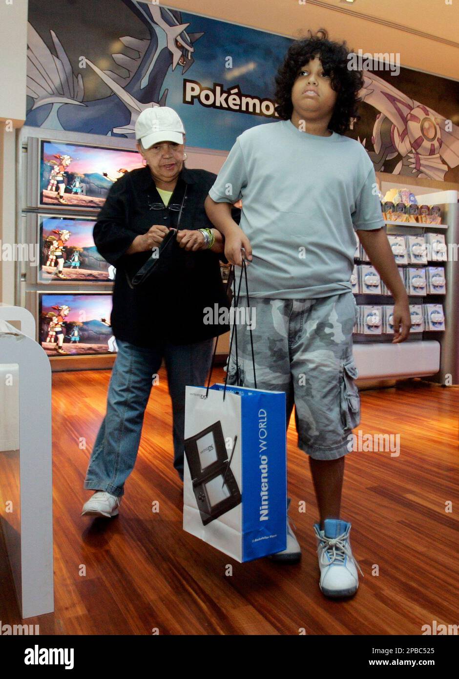 Gabriel 12, and his grandmother Evelyn Rivas leave the