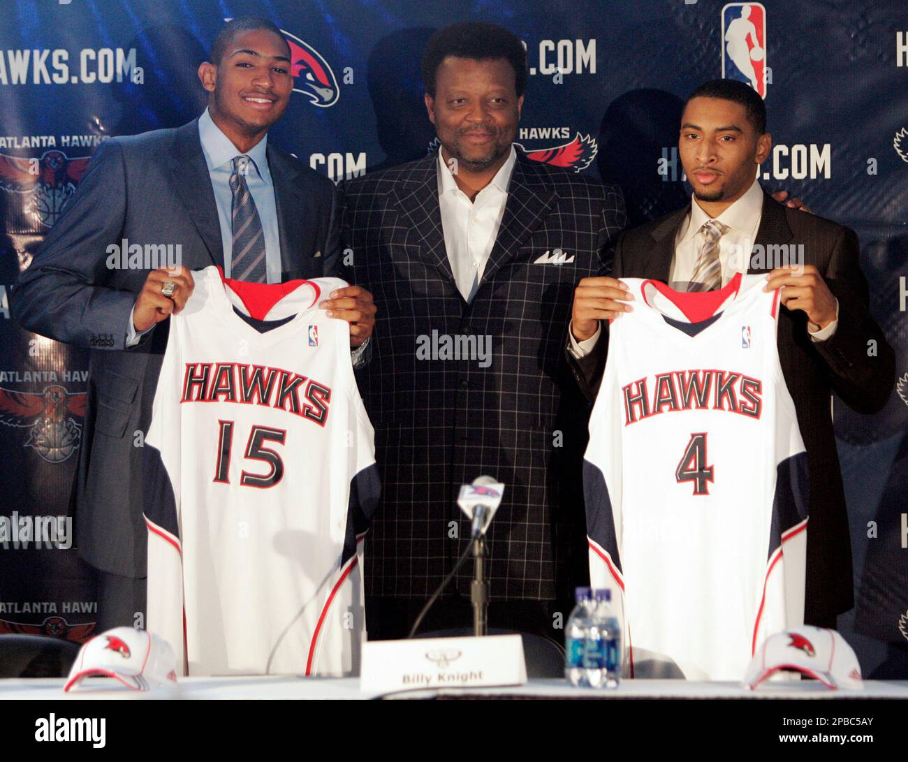 Atlanta Hawks rookies Al Horford, left, and Acie Law IV, right, stand with  the basketball team's executive vice president and general manager Billy  Knight during a press conference to introduce the players, image size:1300x1091